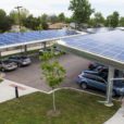 Parking lot covered by solar panels which makes use of open space leading to emissions reduction.