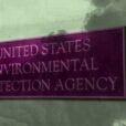 Sign that says United States Environmental Protection Agency with smoke covering it